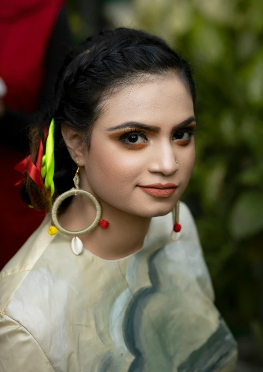 an attractive woman wearing colorful jewelry, with long hair