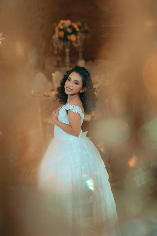 a  in white dresses with a flowered bouquet