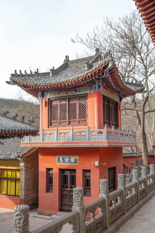 a building with multiple roof tops on each side