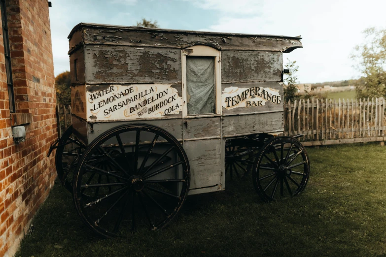 a horse drawn wagon sits in the back yard