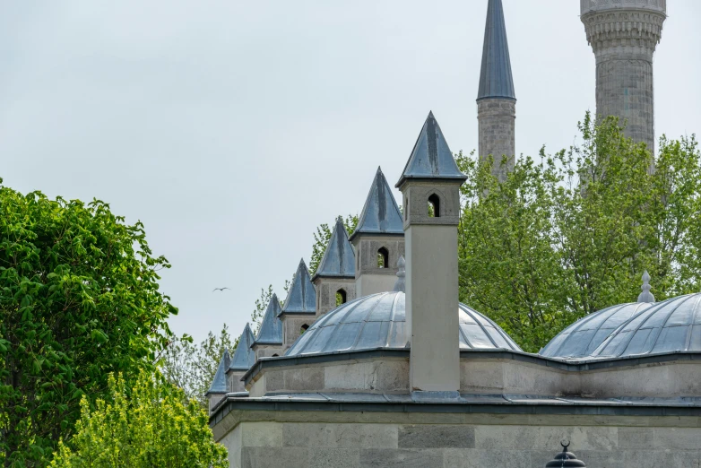 a very tall building with many smaller towers