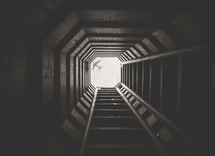 the view from the bottom of an art installation depicting a staircase