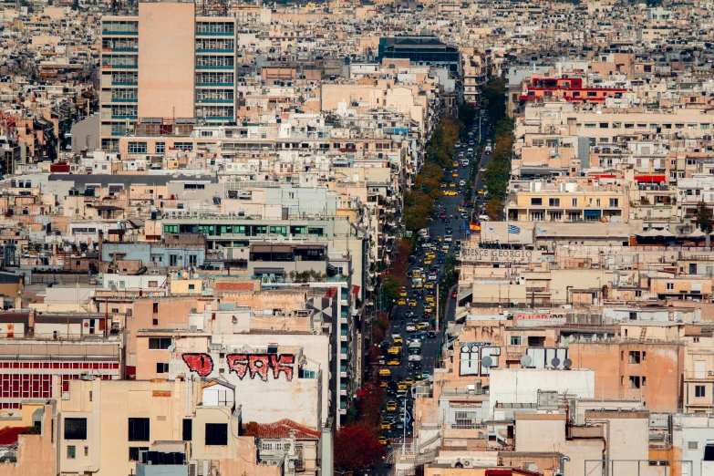 a long line of buildings on the other side of a large city street