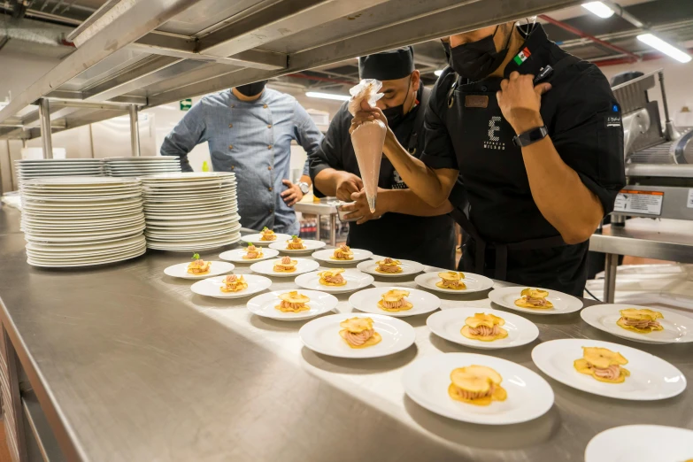 a couple of people that are looking at some food