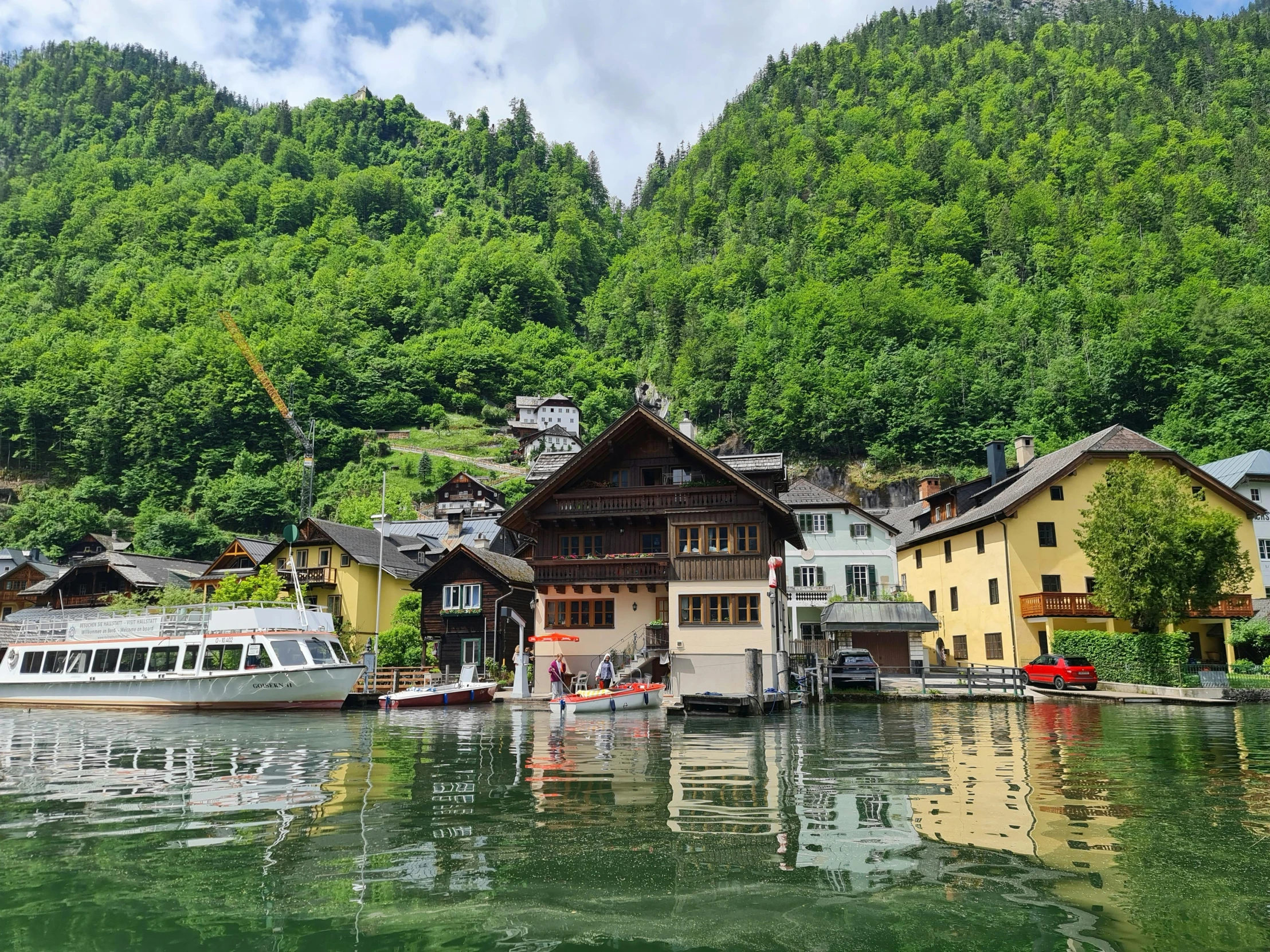 a boat in the water surrounded by trees