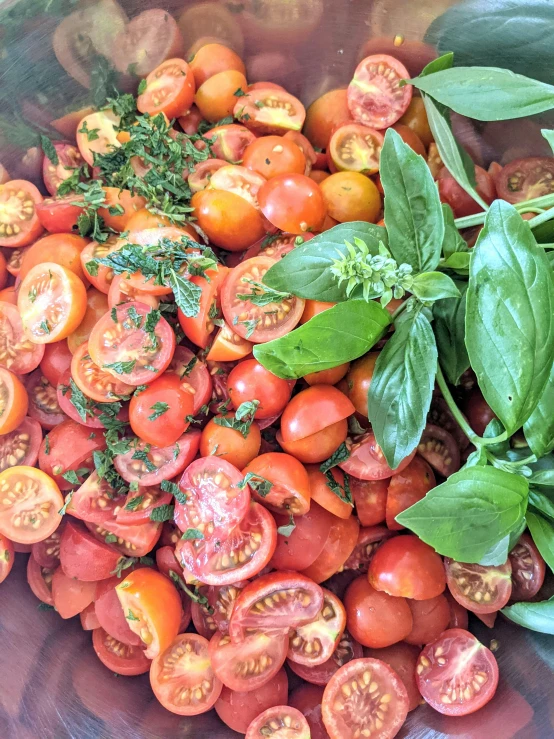 fresh tomatoes and other vegetables are stacked up together