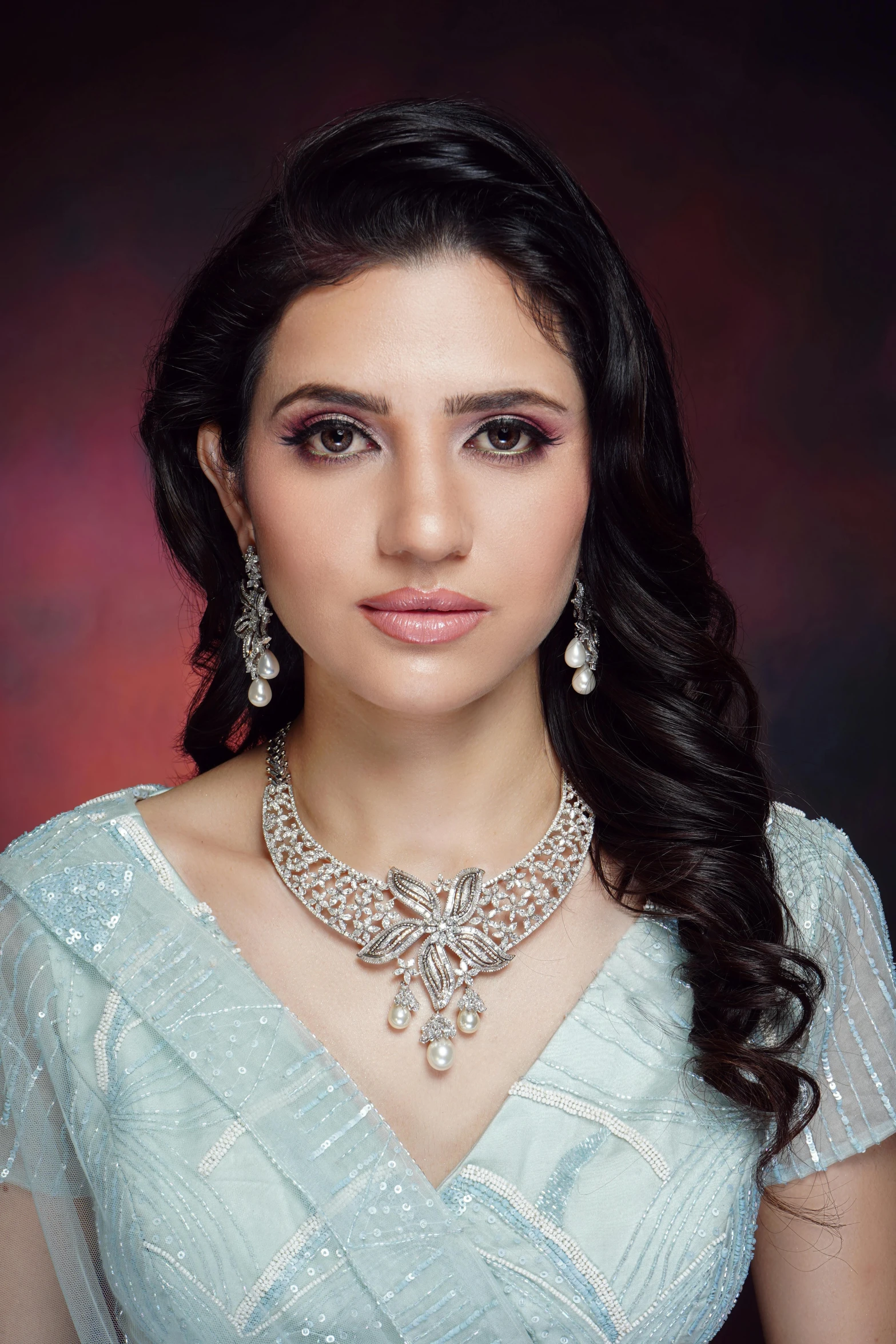 woman wearing fancy diamond necklace and matching earrings