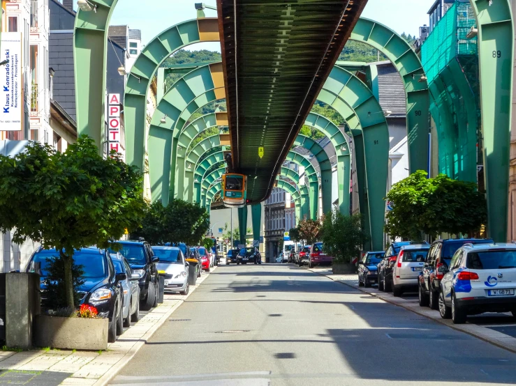 an empty street with cars in the middle