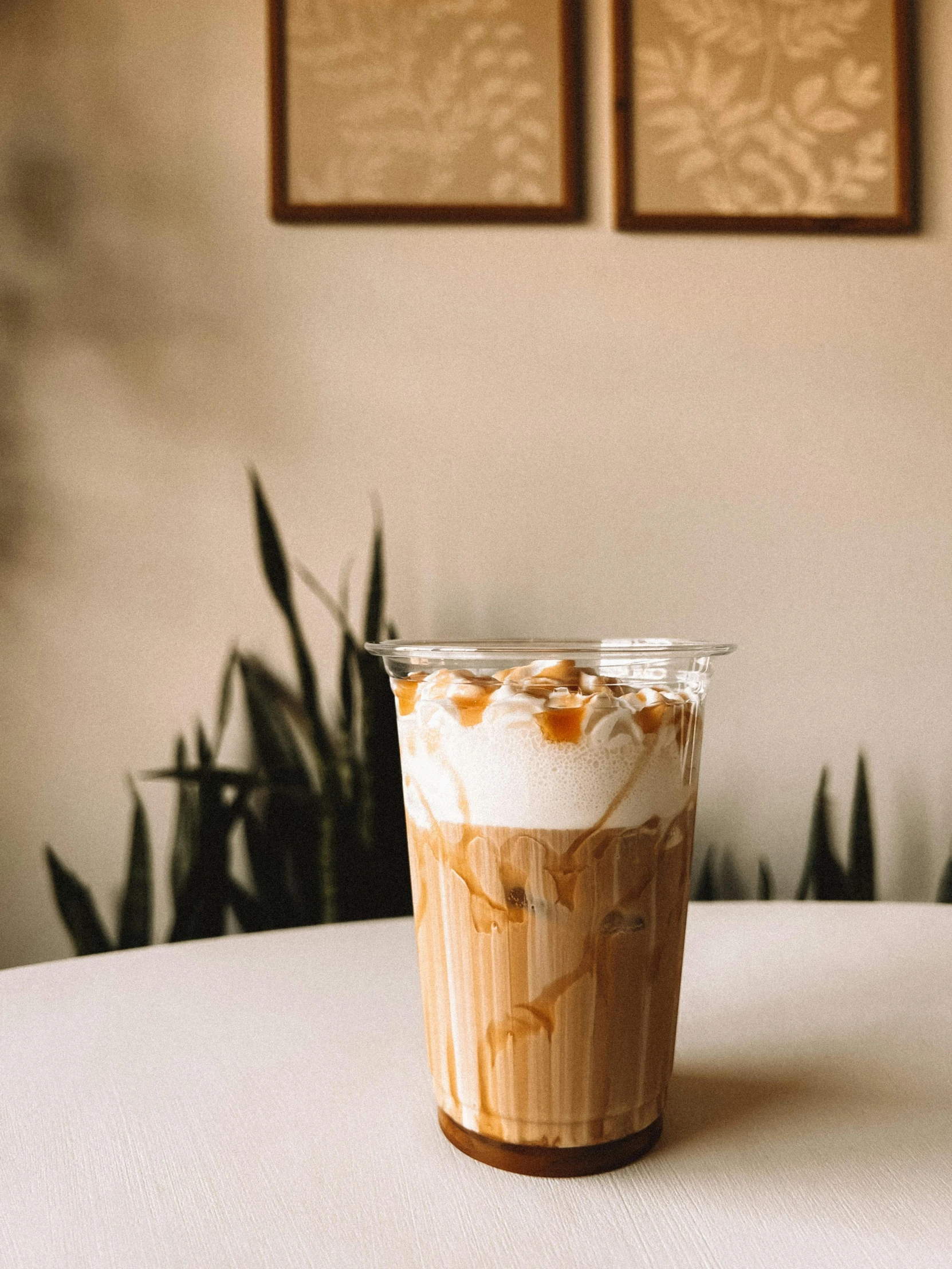 an iced coffee with nuts in it on top of a table