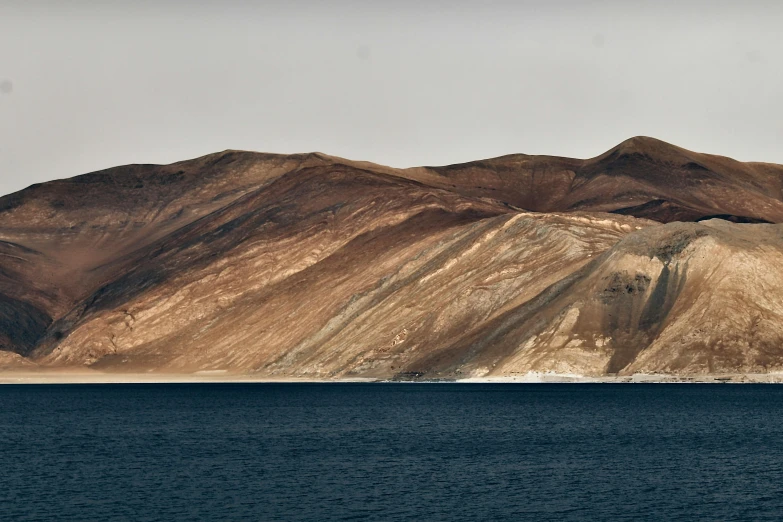 a view of a mountain and a body of water