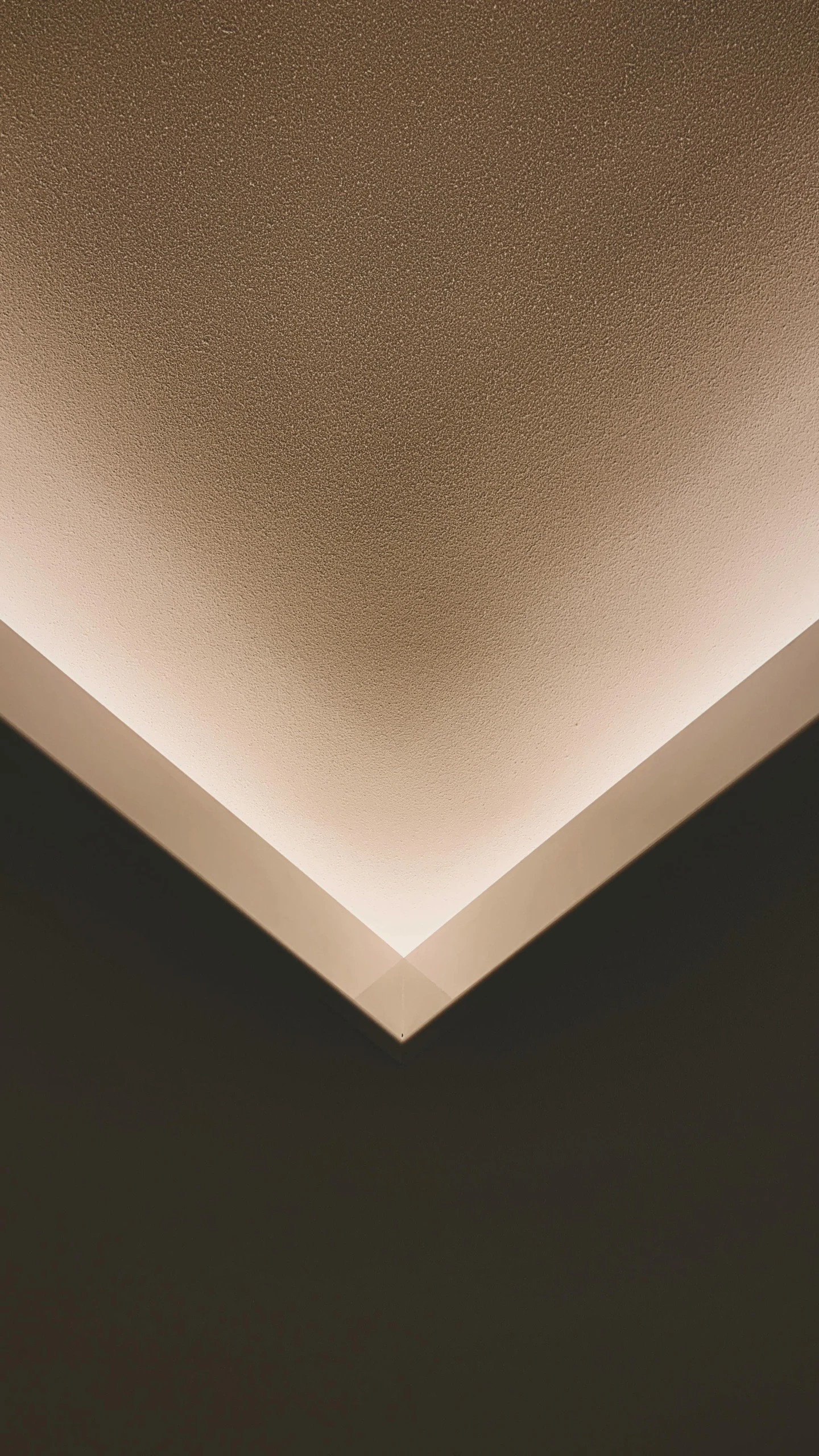 a white square - shaped ceiling is illuminated with the light from below