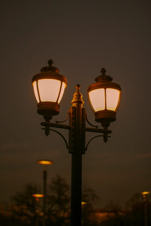 a light pole is lit up at night