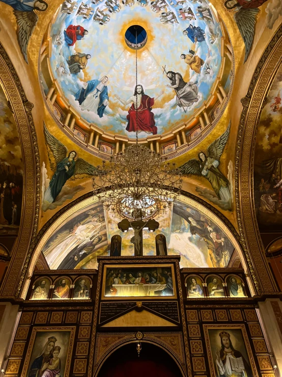 the ceiling in the church with paintings all over