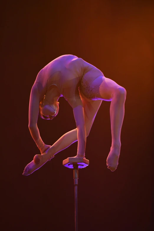 a  man in the air on a pole