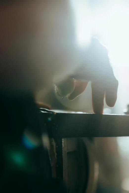 a person is typing on a table top with their fingers