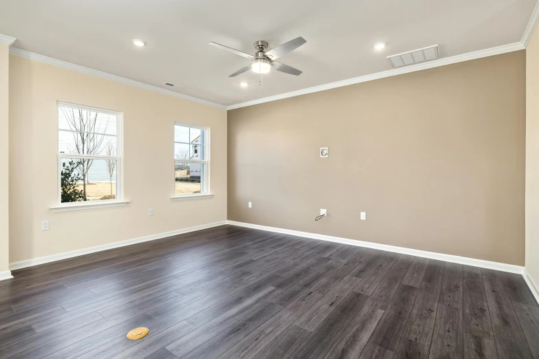 empty room with hard wood floor and high ceiling