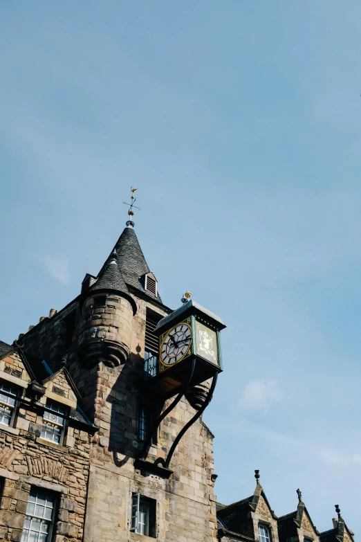 an old brick building with a clock on top