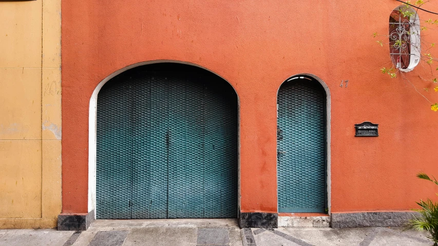 the building's two arched doors and window is brown