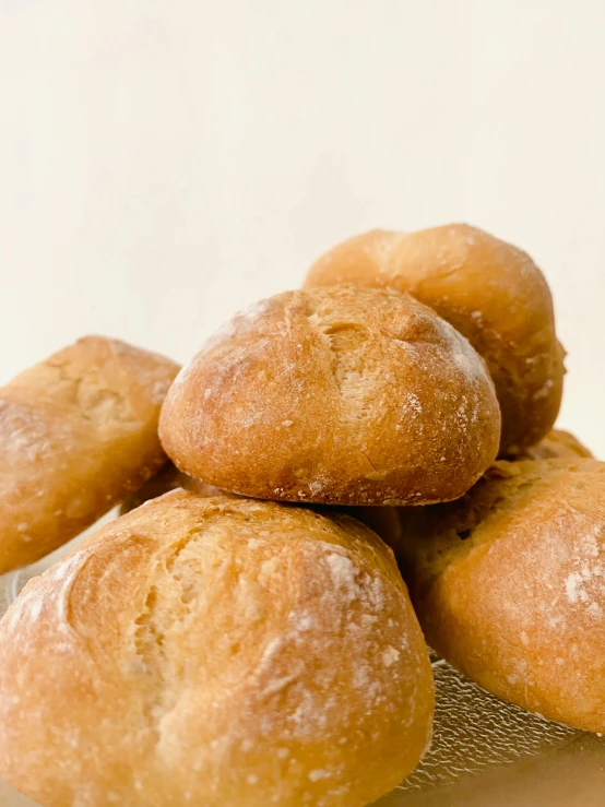 some small round pastries are piled on top of each other