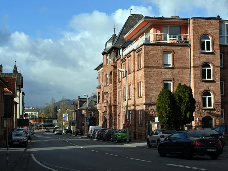 a red brick building on the corner is an apartment