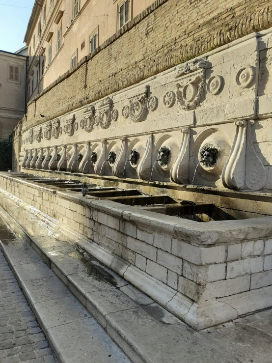 a stone architectural structure made of concrete and brick