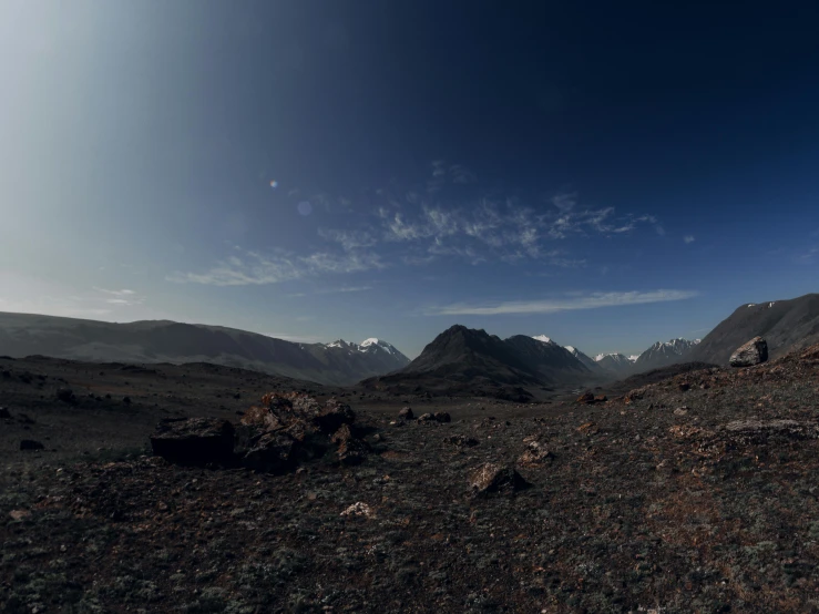 a mountain landscape has mountains and blue sky