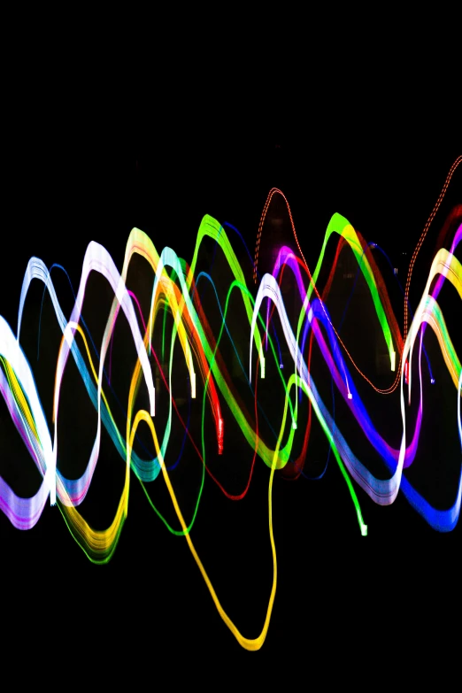 multi - colored lights are glowing against a black background