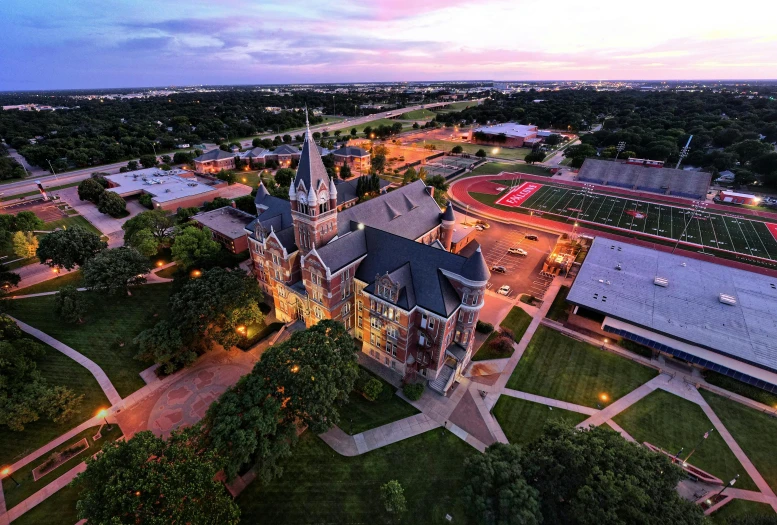 the beautiful cam at dusk overlooking a lit up building