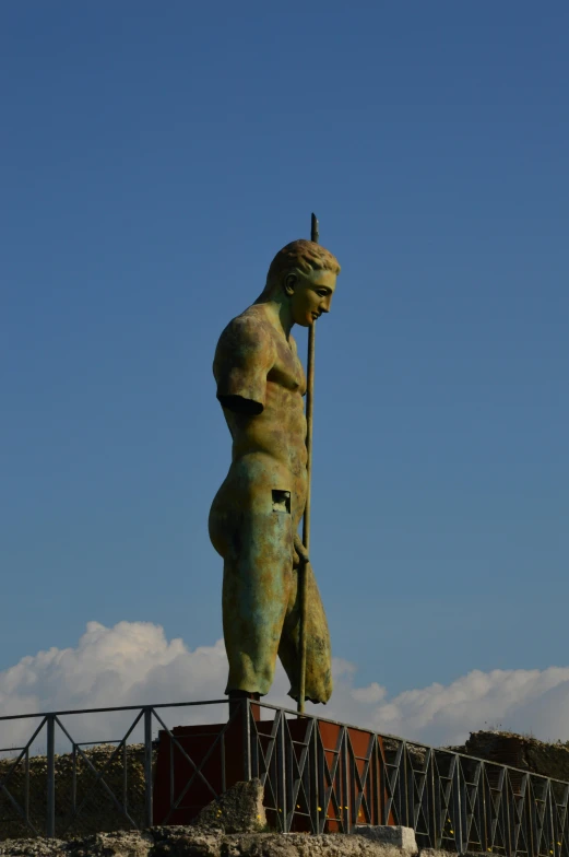 a statue in the middle of a walkway