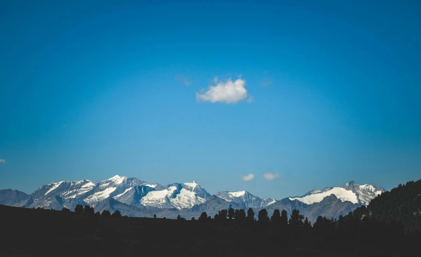 a beautiful view of some mountains from the ground