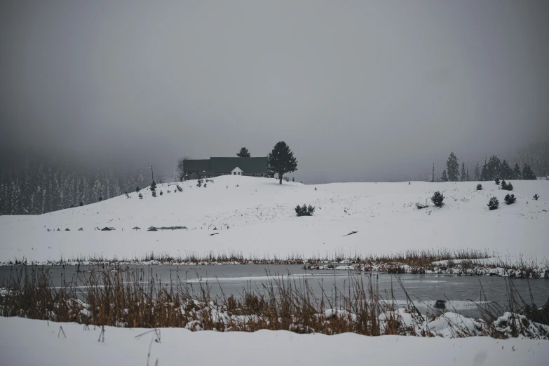 a large hill covered in snow and grass