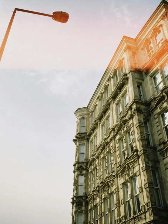 a low angle s of a building that has been painted orange