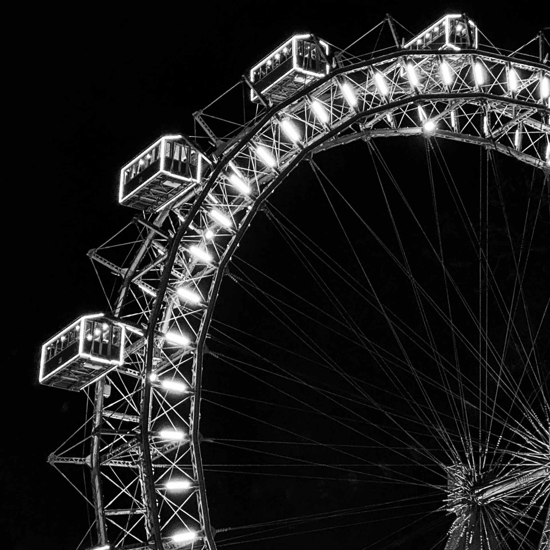 a very large ferris wheel at night with many lights