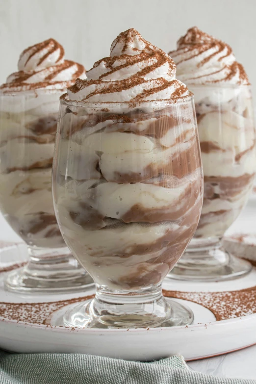 three goblets of chocolate and cream dessert