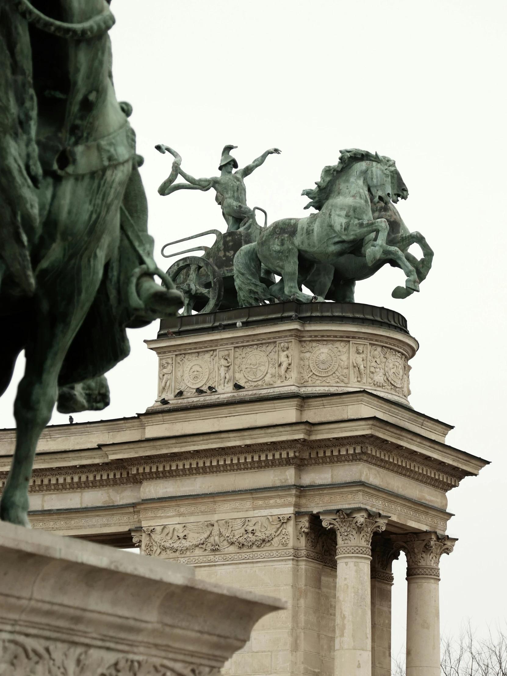 a statue that has two statues on it