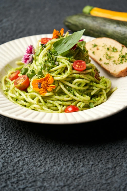 a plate with a piece of bread and some veggies