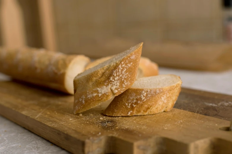 two sliced loaf of bread sit on a  board