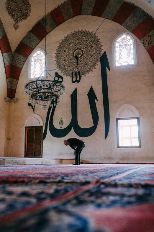the inside of an old building with a ceiling and arabic writing on the wall