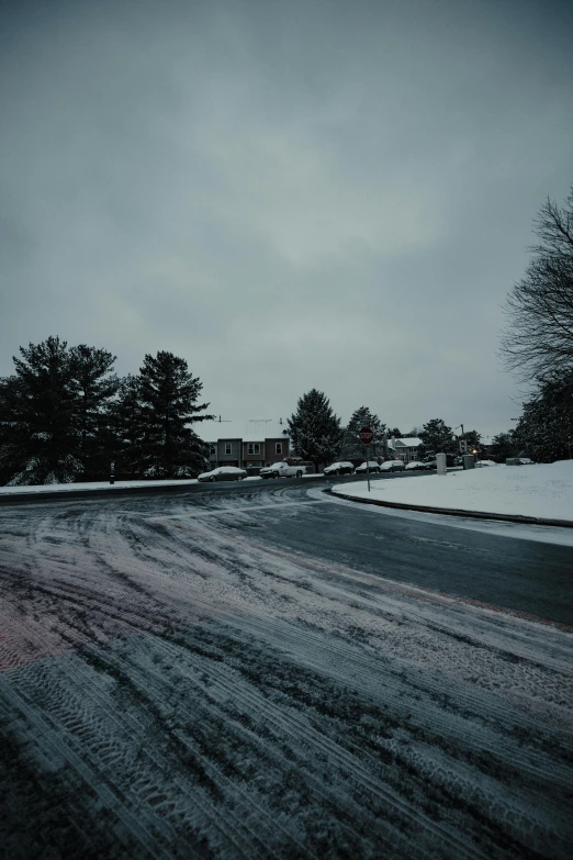 road with traffic lights and car approaching in the distance