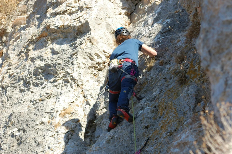 a man that is on top of a rock