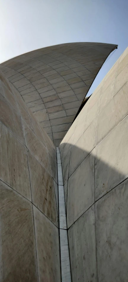 a curved staircase is painted beige and leading to an interesting building