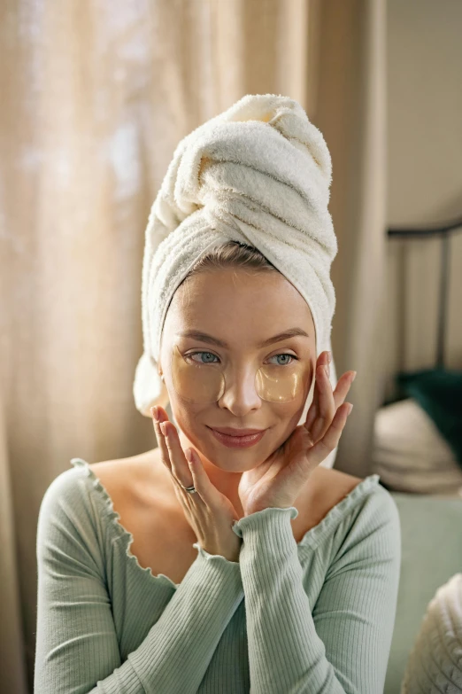 woman with white robe wrapped around head wearing a towel