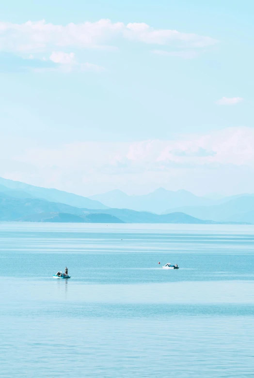 a person riding a jet ski in a large body of water