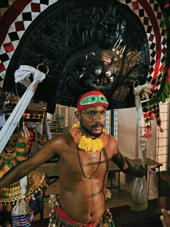 an indian man wearing a headdress and 