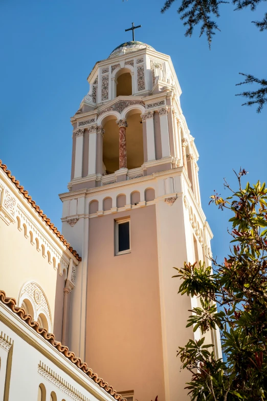 a very tall white building with a clock on it