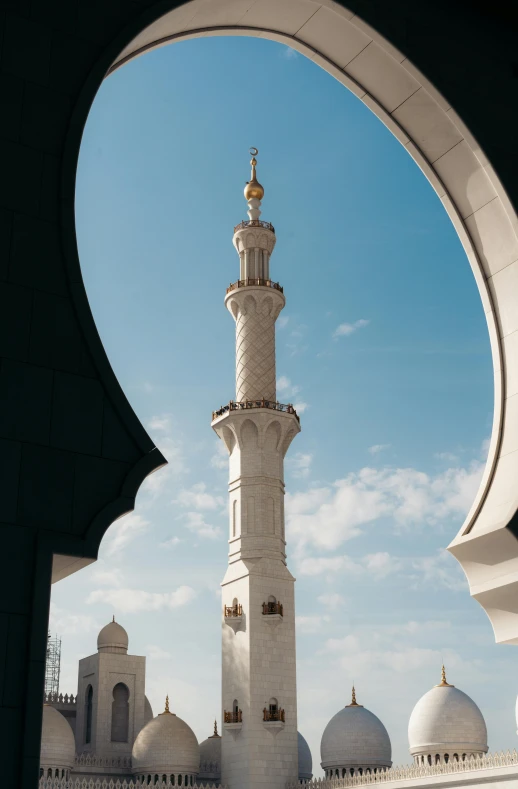 a very tall white tower standing in the middle of a building