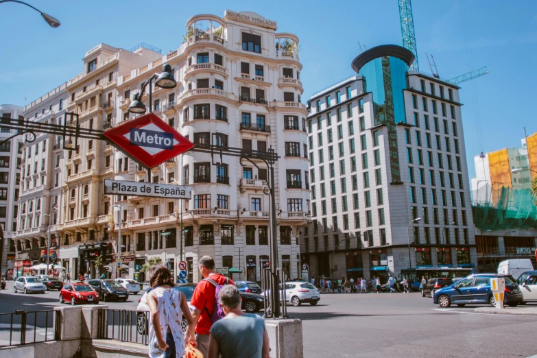 people walking by an intersection on the street