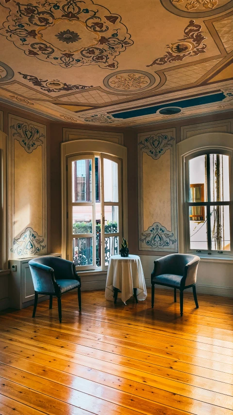 a dinning room with fancy ceiling tile and stained glass