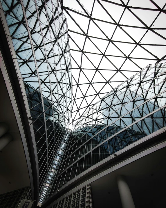 glass roof at an airport with buildings and skyscrs