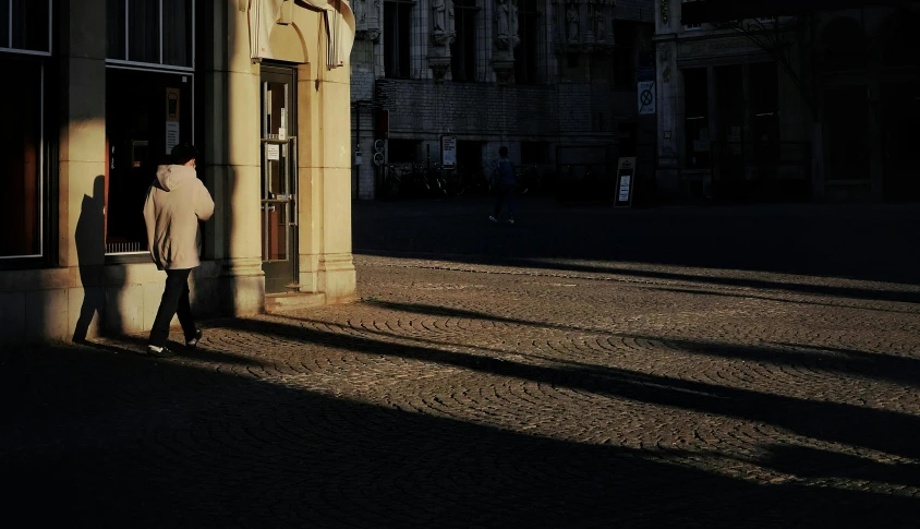 a person is outside a building and it is dark